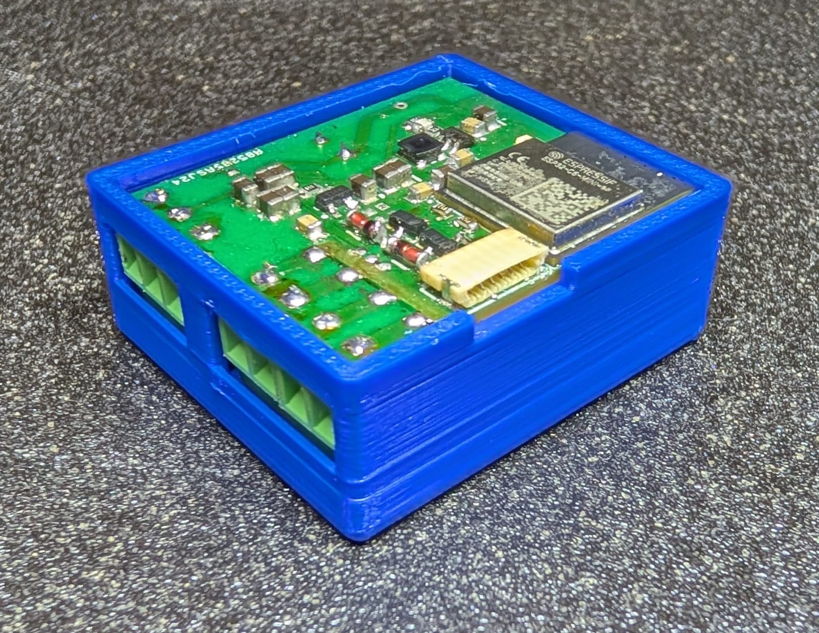 Compact ESP32-C6 industrial controller prototype inside a blue enclosure